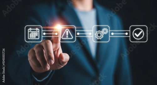 A person in a blue blazer interacting with a digital workflow process interface with icons displayed