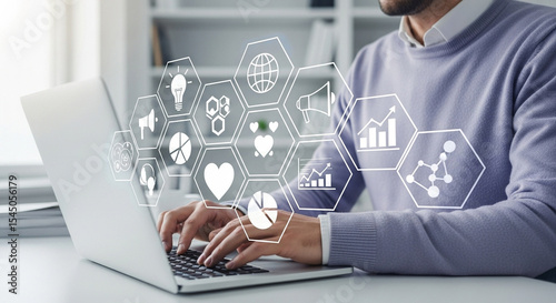 Man typing on laptop with digital marketing icons overlayed in a bright office setting clearly visible