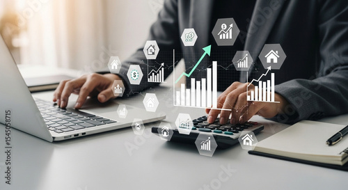 Person working on laptop and calculator with financial charts and graphs overlayed on the image