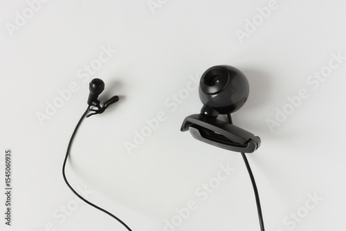 Webcam and wired microphone. White background.