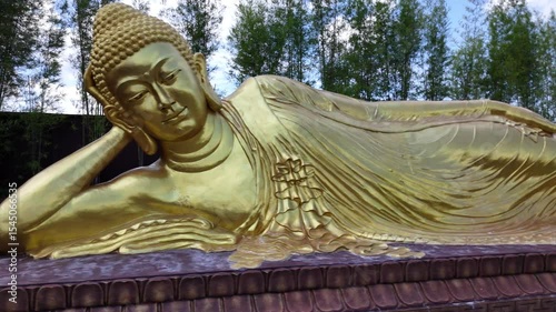 B-roll footage of Maha Vihara Mojopahit temple in East Java, featuring its grand architecture, Buddhist statues, serene courtyards, and spiritual atmosphere surrounded by lush tropical greenery.