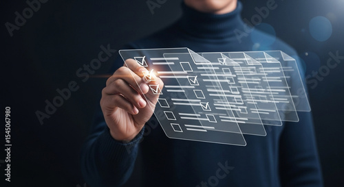 Person marking a digital checklist with a stylus on a transparent futuristic interface display screen