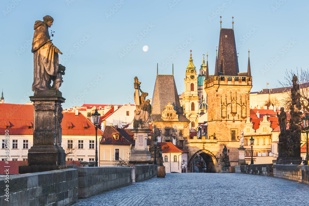 Fototapeta premium Prague's Old Town: Charles Bridge Statues and Medieval Towers at Sunrise, Prague, Czech republic