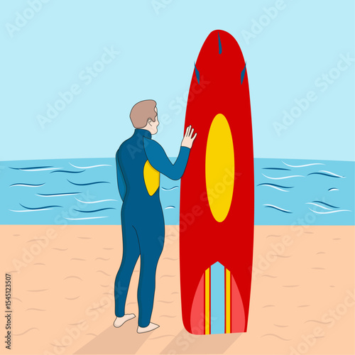 A lifeguard in a blue wetsuit stands next to a red and yellow rescue board on a sandy beach with the ocean in the background.