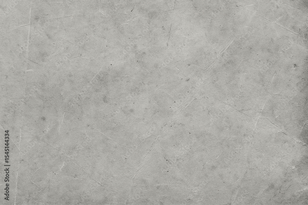 Naklejka premium Rough gray concrete surface with visible scratches and worn marks, ideal for backgrounds, industrial designs, or grunge-style creative projects.