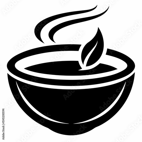Bowl of hot soup with leaf isolated on white background
