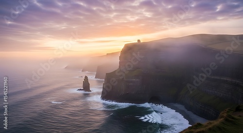 Dramatic cliffs of moher sunset with misty coastline