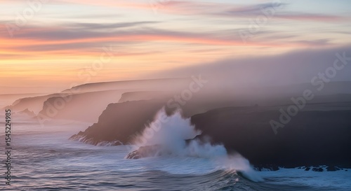 Dramatic sunset waves crashing against misty cliffs