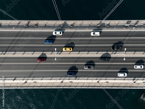 Aerial top down view of big suspension bridge above Bosphorus with heavy traffic, Istanbul, Turkey
