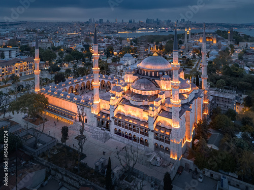Aerial night cityscape of Sultanahmet district illuminated ancient Blue Mosque, Istanbul, Türkiye