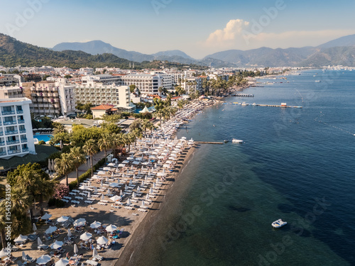 Mediterranean resort luxury hotels seafront, beaches and promenade on sunny day, Marmaris, Türkiye