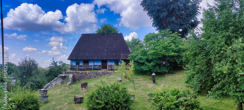 Rural house in Ukrainian style. Beehives near the house. Museum of Folk Architecture and Rural Life. Uzhhorod. Ukraine. Europe	