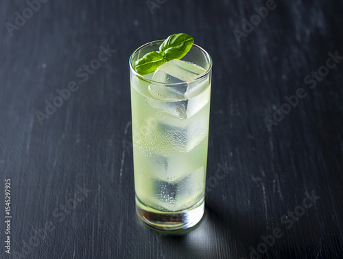 Refreshing basil cocktail recipe summer drink with ice cubes and garnish idea