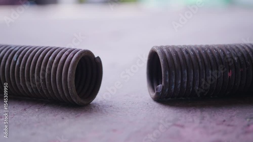 Broken Garage Door Spring Close-Up | Damaged Torsion Tension Spring