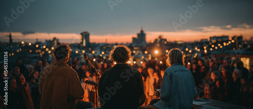 Rooftop concert during Aarhus Festuge, indie band playing with views over the city skyline, intimate crowd swaying to music under festoon lights. 