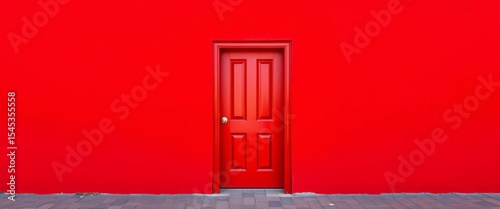 A single red door set within a plain red wall,  red wall,  panel