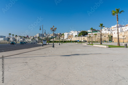 Scenic views of Tangier's seafront and old medina walls on a sunny day, showing a mix of coastal charm, public spaces, and historic Moroccan architecture