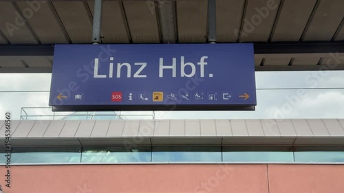Linz main train station sign on platform