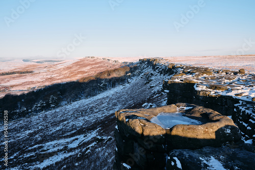 Morning light on Stanage Edge with snow, Peak District, UK