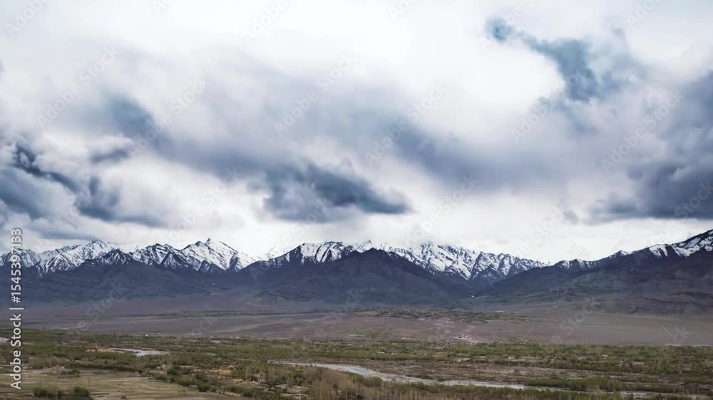 Majestic Mountain Range Under a Cloudy Sky, High Altitude Landscape Majestic Mountain Range Under a Cloudy Sky, High Altitude Landscape