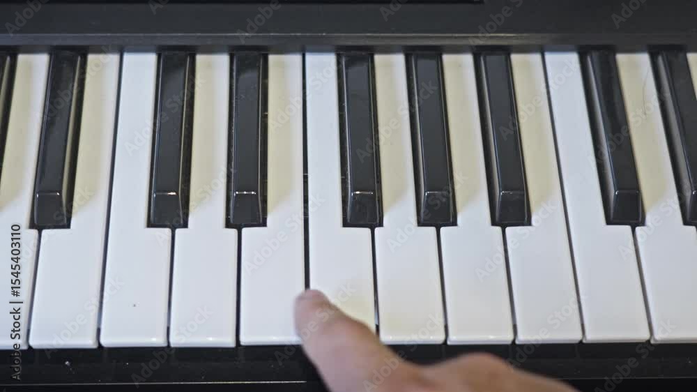 Electric Piano Playing Keys Up From C to B Repeatedly White Male Hand