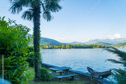 Spring view of Lake Lugano in the town of Caslano in the Swiss mountains