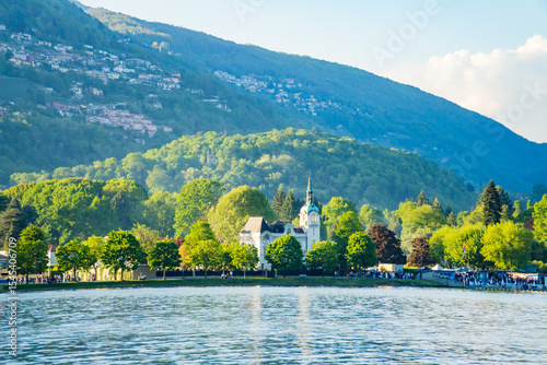 Spring view of Lake Lugano in the town of Caslano in the Swiss mountains