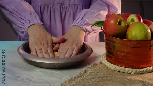 Preparing a pie crust with fresh apples in a cozy kitchen setting