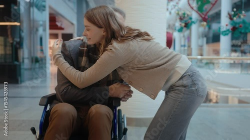 Woman-assistant holding mature mans hands, providing caring and helping
