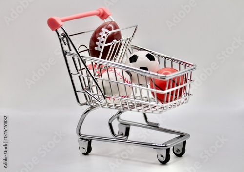 miniature cart full of balls from various sports