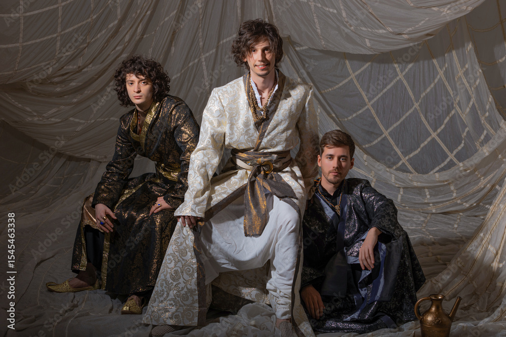 Obraz premium Charismatic guys in oriental costumes. Arabic or Turkish style, costume photography