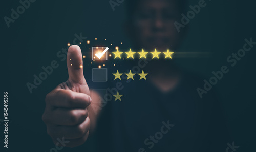 Customers experience satisfaction concept. Standardization and quality in products and services. Hands of client thumb up and check mark for select five stars. Excellent services rating.