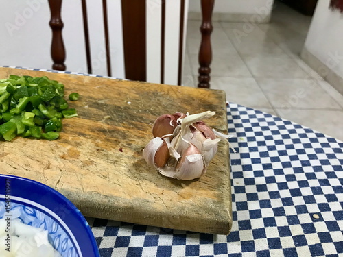 Raw Chicken, Chopped Onion, Green Peppers and Garlic