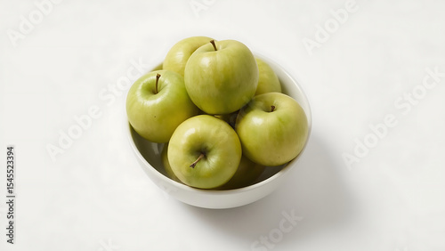 Green apple freshness in a white bowl overflowing with crisp, juicy green apples, perfect for food blogs, healthy lifestyle articles, or recipe websites.