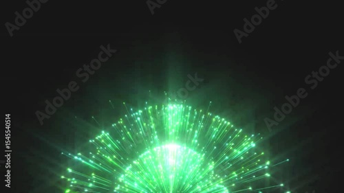 A vibrant green light display resembling a burst or explosion, creating a dynamic visual effect against a dark background.