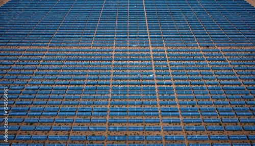 Aerial view of massive solar farm, generating renewable energy on desert land