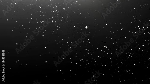 white glitter snow particles falling on black background night