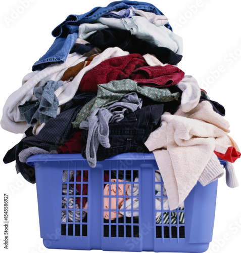 Overfilled blue laundry basket with a mountain of clothes and textile garments