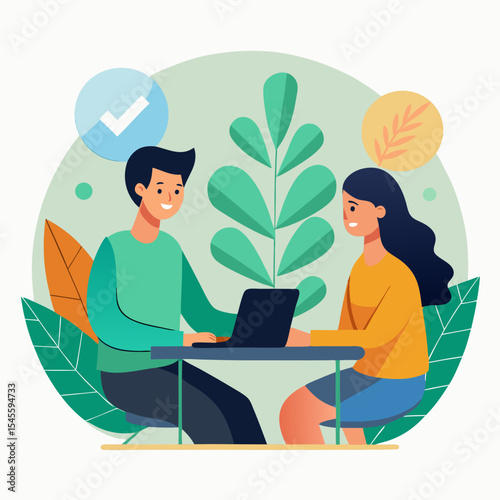 Two people working together on a laptop at a table
