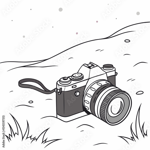 Vintage camera resting on grassy hillside