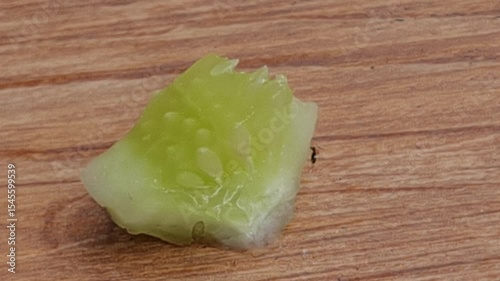 Close Up of Fresh Cucumber Slice on a Wooden Board Macro Shot