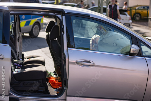 Crashed car with damaged front and opened airbags