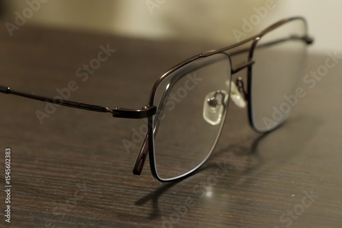 Modern Eyeglasses on Dark Wooden Table