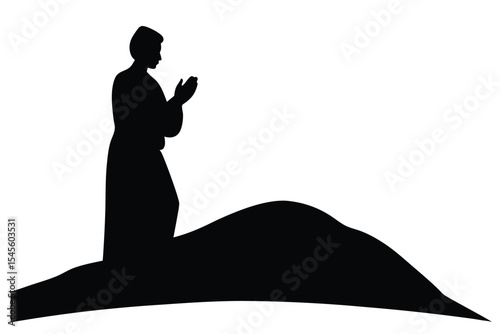 Silhouette of person praying on a hilltop at sunset