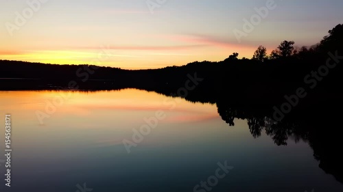 Wallpaper Mural Serene Lake at Sunset Reflecting the Sky and Forest Silhouette in Calm Waters Torontodigital.ca