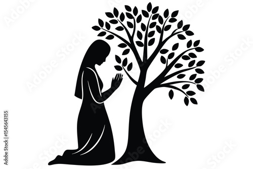 Silhouette of woman praying under a tree