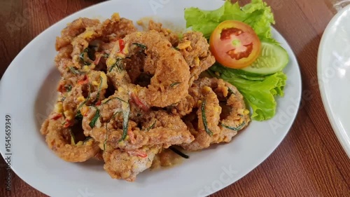 Serving Fried Rings on Plate with Vegetables