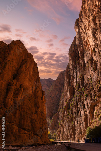 Rocky canyon, people, clear blue sky.