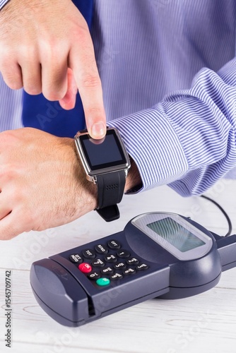 Man using smart watch to express pay