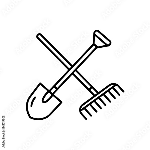 Gardening tools including a shovel and rake in a crossed position  